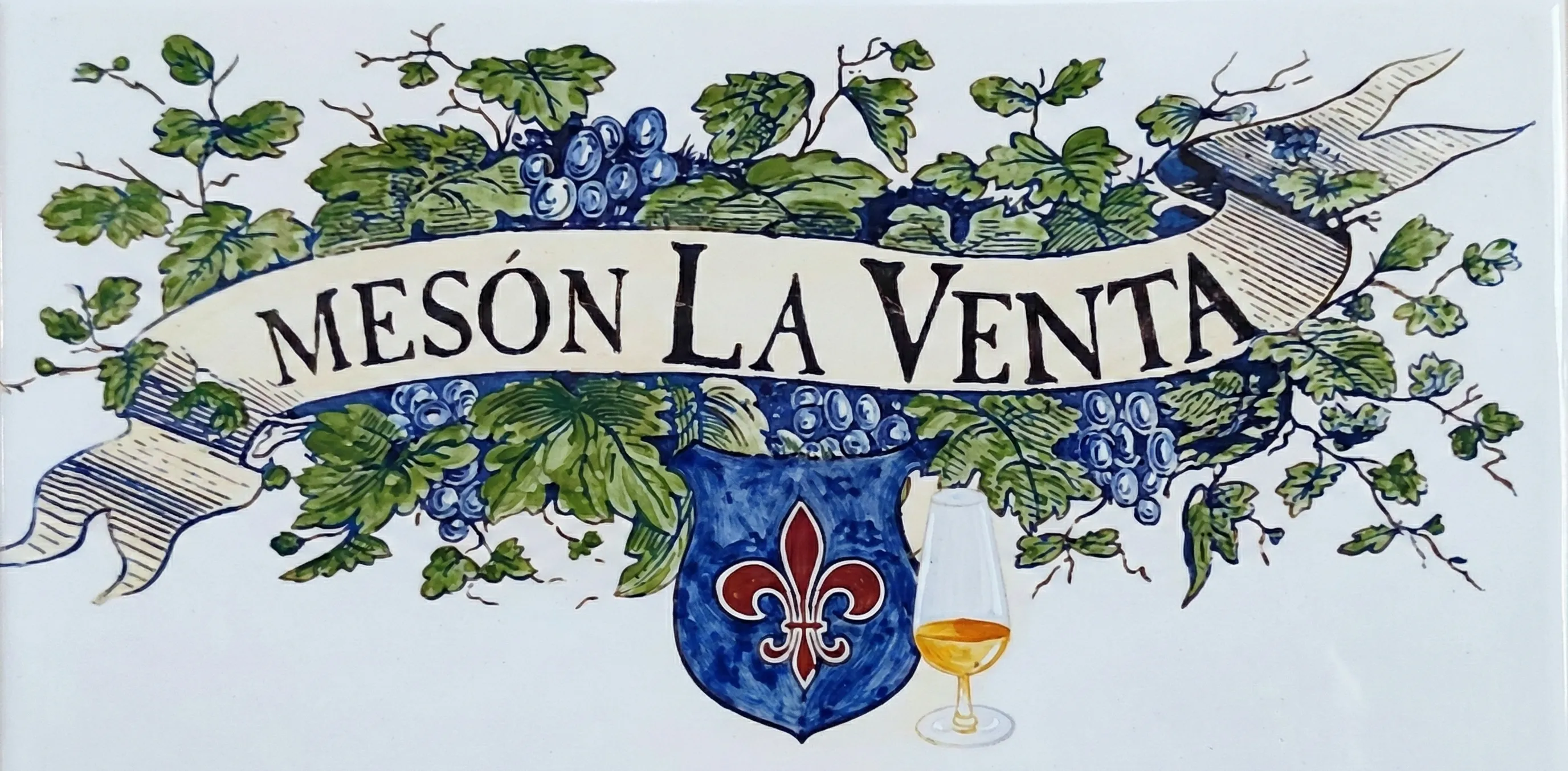 Fachada y azulejo de Mesón La Venta